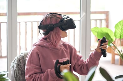 Woman in VR with headset and controllers