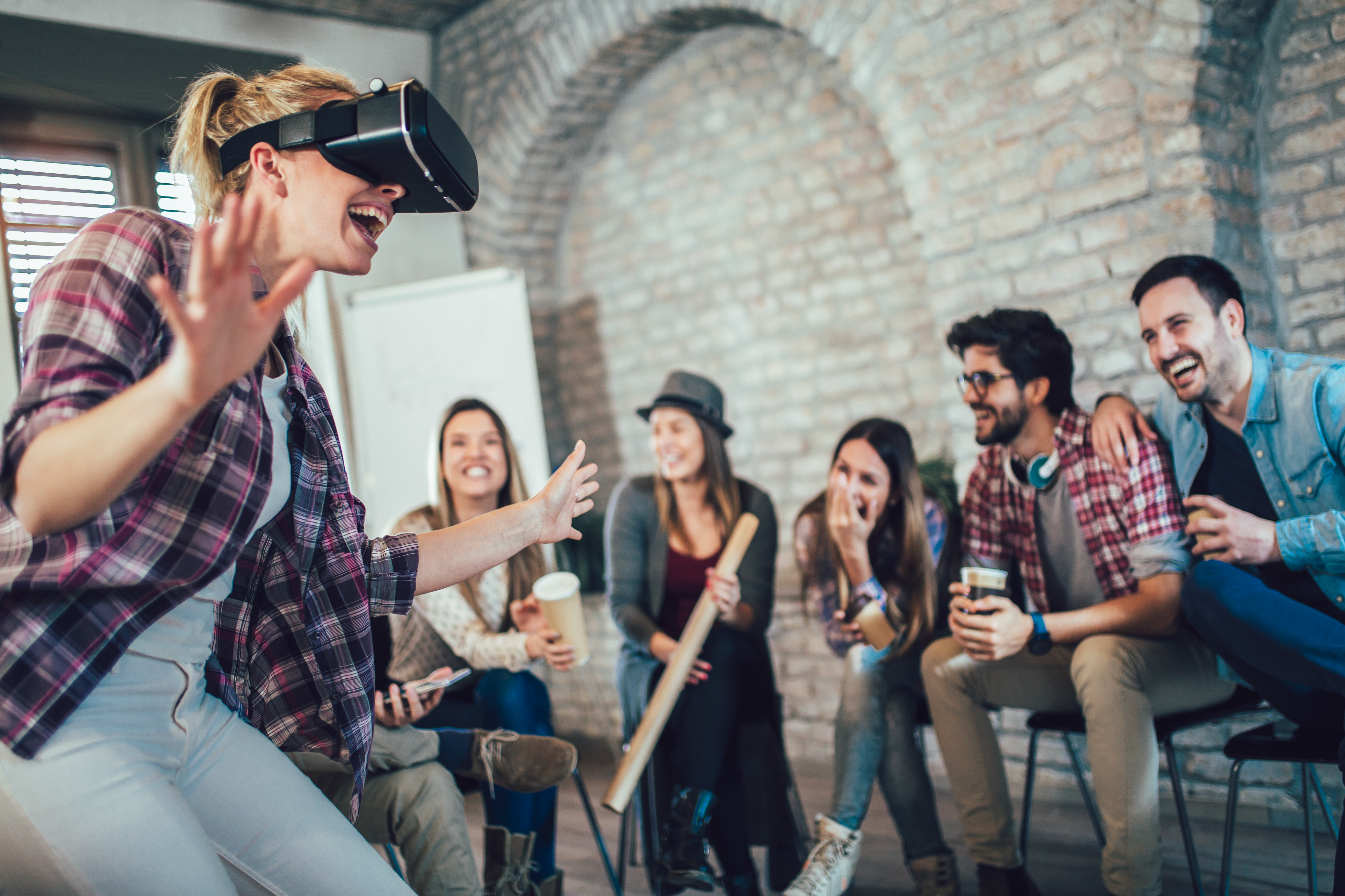 Woman in VR headset in corporate team building event